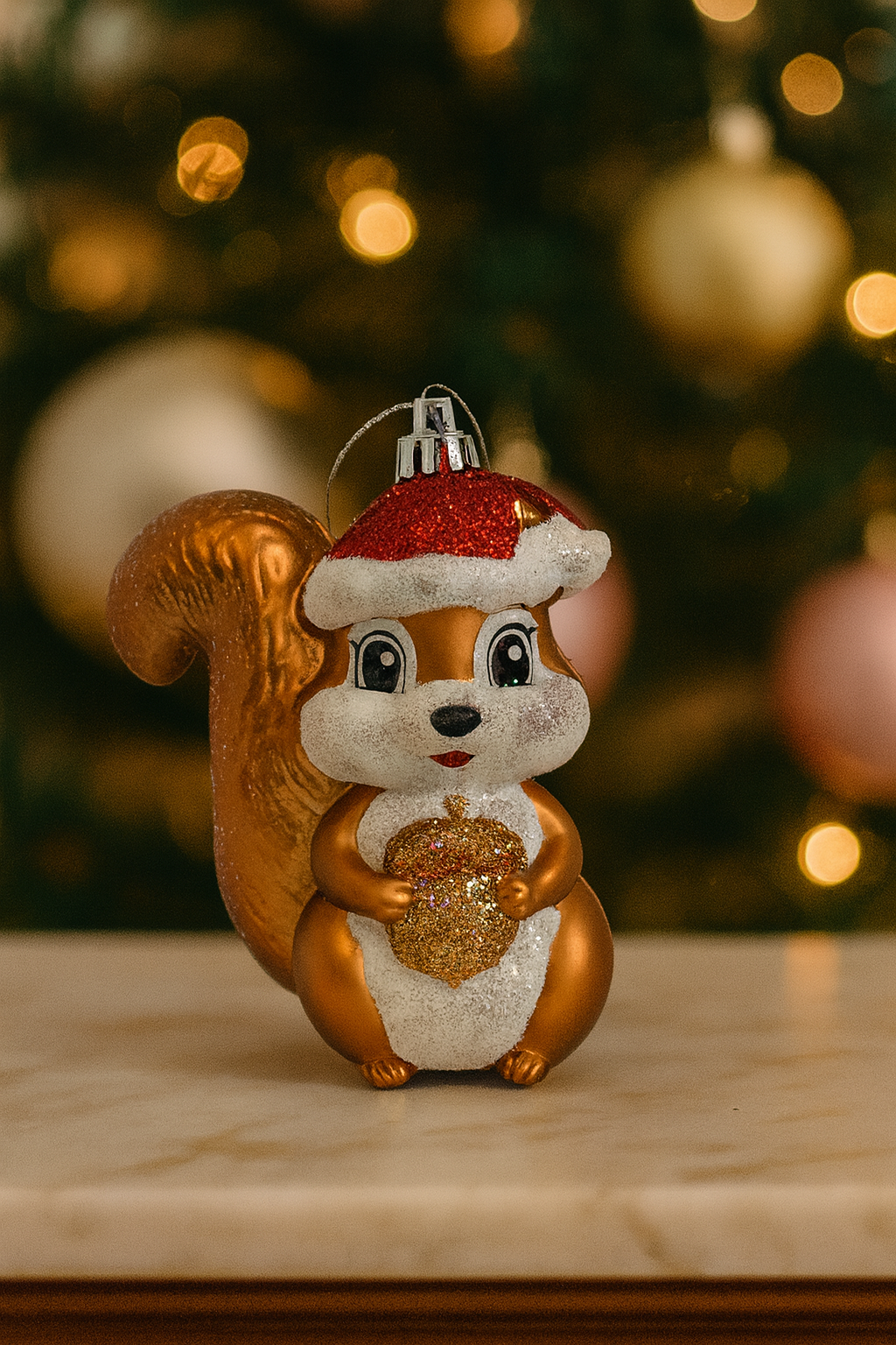 Gold squirrel Christmas ornament with Santa hat & acorn, 11cm