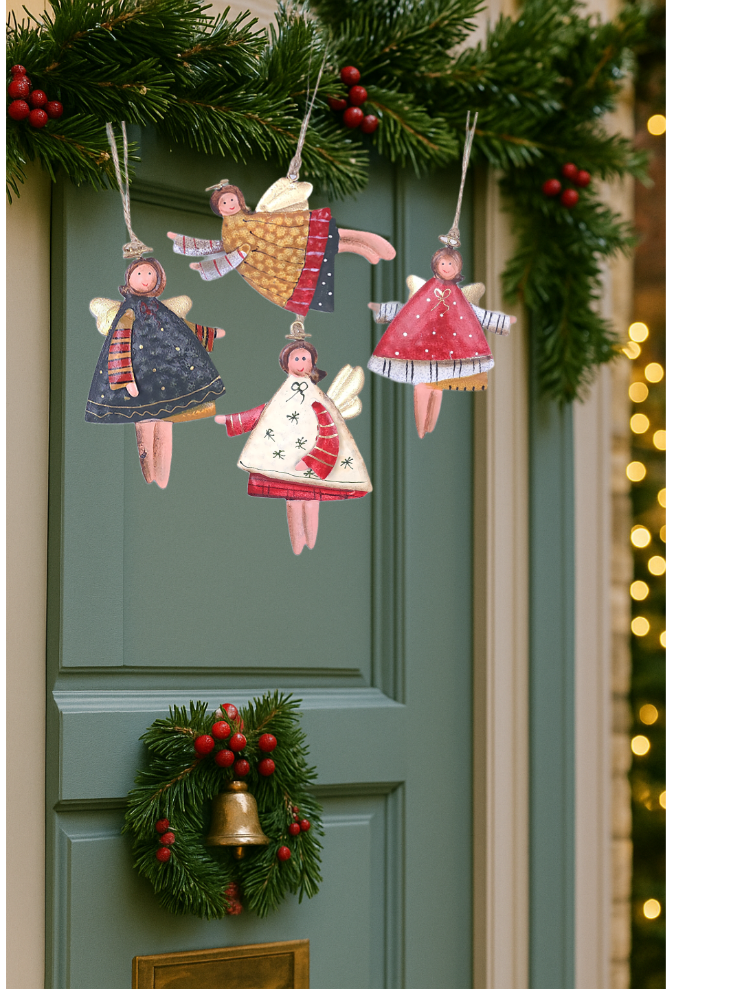 Decorative angel figurines and a wreath on a door with Christmas decorations.